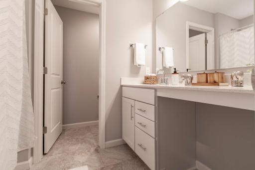 The other two bedrooms have immediate access to this oversized full bathroom.