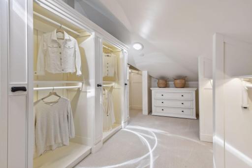The primary closet has been customized to the fullest with 90 degree turn out clothes rods and HUGE extra deep storage drawers behind, full LED backlighting, solar tubes with built in LED lighting and full height accessory pullout storage.