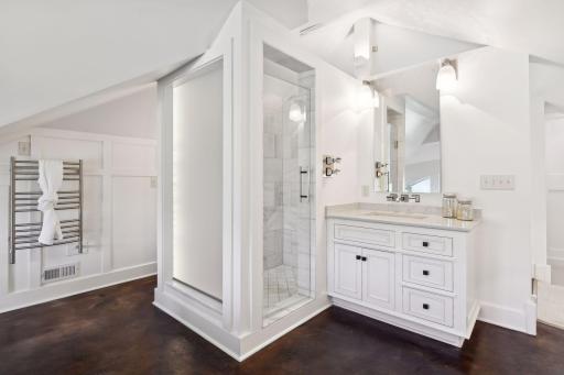 Primary bath with double vanities and ambient LED fiber optic lighting gives the space a spa like feel.