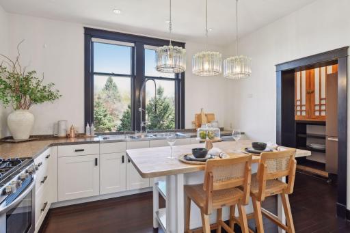 Kitchen with center island, ample countertop space and sturdy cabinet drawers complete with organizers. Enjoy views out your kitchen window that are reminiscent of a private estate up north.