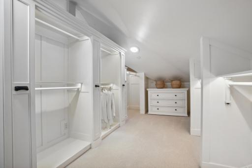 The primary closet has been customized to the fullest with 90 degree turn out clothes rods and HUGE extra deep storage drawers behind, full LED backlighting, solar tubes with built in LED lighting and full height accessory pullout storage.