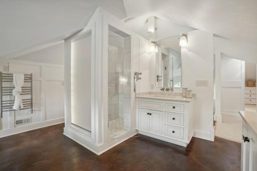 This bathroom has everything! Complete with floor to ceiling tile walk- in shower, and heated towel rack.