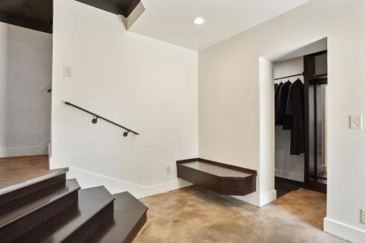 Wonderfully designed lower-level mudroom.