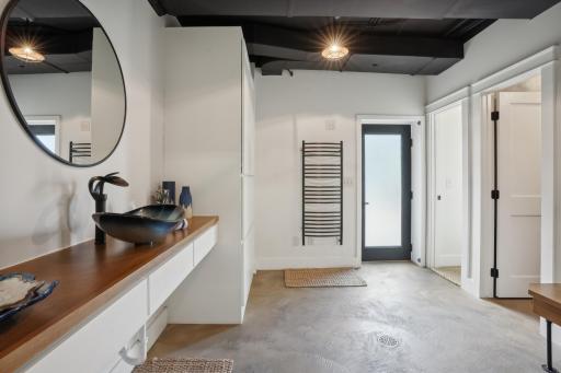 No worries when it comes to dragging pool water through the house on a hot summer day. This poolside bathroom has all the spa-like features any guest could ask for, all tastefully done in the same cohesive high end style.