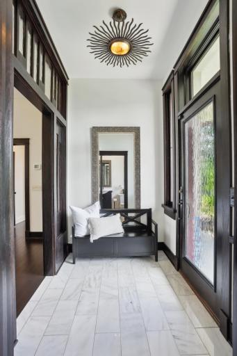 Marble front entry with guest powder room.
