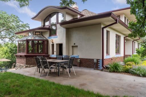 The conveniently located entrance to the hilltop patio lies directly off the kitchen, for alfresco dining and easy grill access.