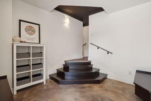 Wide boot benches and spacious walk-in coat closet- an elegant way to organize and store winter jackets, boots and more.