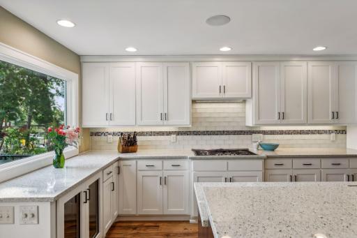 Custom element surface (recycled glass) kitchen countertops & glass tile backsplash