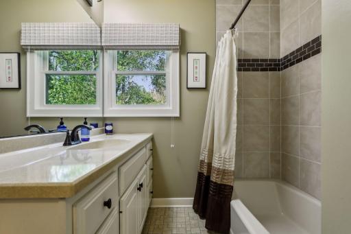 Main level full bath conveniently located between the bedroom & office.