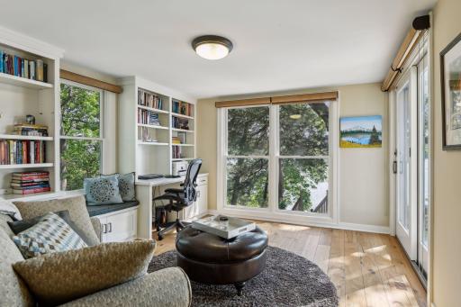 Main level office / den with built in library and inspirational views of the river valley