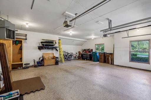 The attached oversized 2-car garage is heated and has beautifully epoxied floors.
