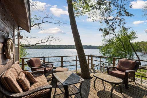 Private deck off the boathouse at waters edge.