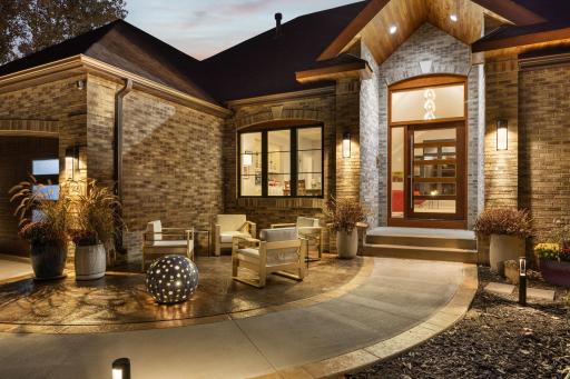 Front Patio & Mahogany Pivot Front Door
