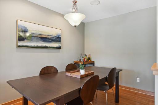 The formal dining room is adjacent to the kitchen with built-in speakers for light dinner tunes