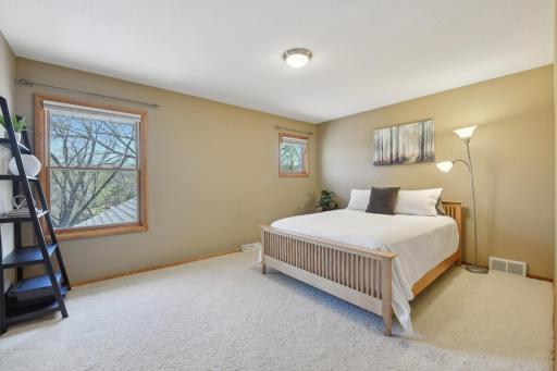 The second bedroom on the upper level also offers a private 3/4 bath and walk-in closet