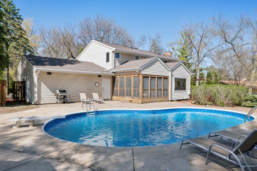 Refreshing pool with diving board is sure to offer hours of summer time fun