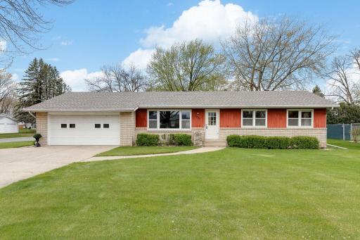 Spacious One-Level Home on a corner lot with dual concrete driveway access.