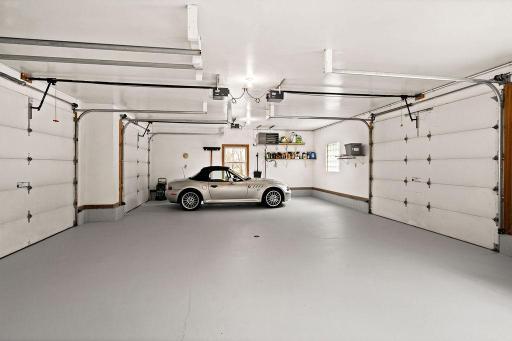 This is an oversized garage! With 4 insulated doors, and 3 floor drains, and it's own thermostat system, it's set for all year round.