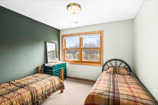 The first of 4 bedrooms on the upper level, is nonconforming, but is used as a bunk-room.
