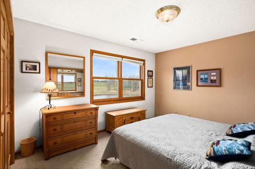 The second of 4 bedrooms has beautiful views of the vineyard.