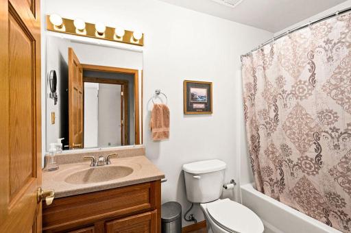The first full bath on the upper level, sits outside the 3 first bedrooms.