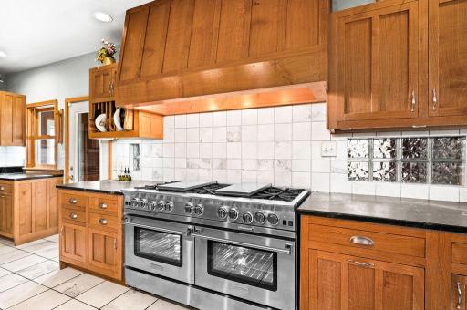New, custom 60-in Bluestone range with 6 variable BTU burners, a griddle and a grill! This range has two large convection ovens with turbo technology.