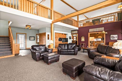 This great room has ample space, with 15' ceilings.