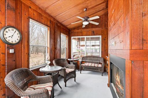 This 3 season porch features a wood burning fireplace, 10' high vaulted ceiling and plenty of seating room.