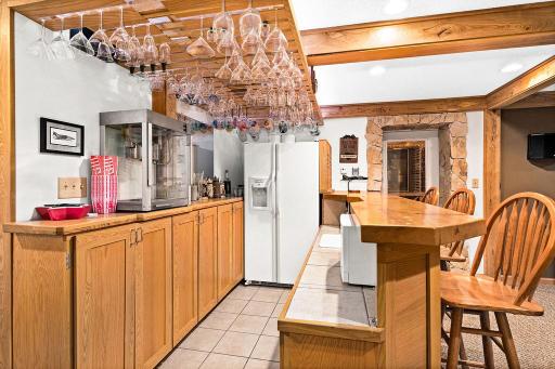 The lower level, entertainment area, features a full wet bar.