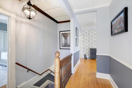 Upper level landing, wide staircase, beautiful banister