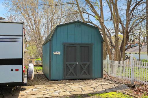 Storage Shed behind garage for extra space