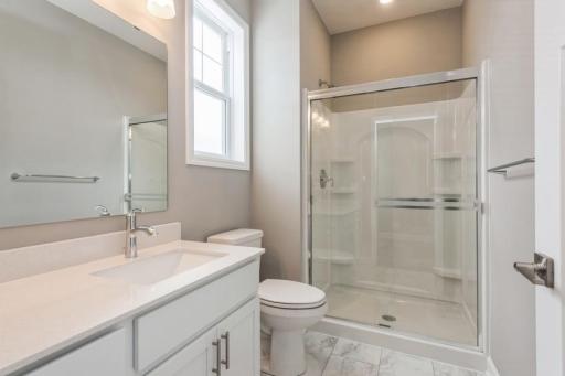 (Photo of a similar home, actual homes finishes will vary) This main level 3/4 bathroom provides convenience and the potential for a main level guest room.