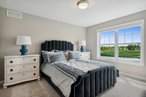 (Photo of decorated model, similar floor plan, colors, finishes and features will vary) The third generously sized upper level bedroom with a spacious closet. Plus, an en-suite 3/4 bathroom is connected.