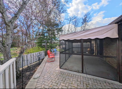 Welcome home to 1241 Black Oaks Ln, Plymouth - Enjoy this extensive wrap around patio & screened porch