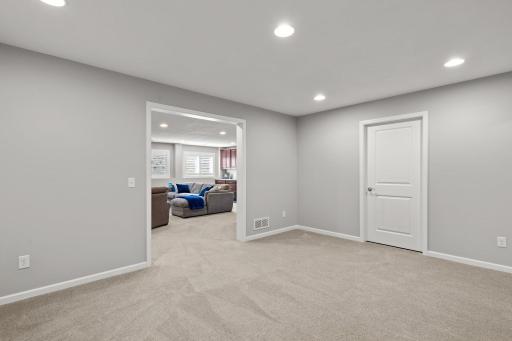 The possibilities are endless for this versatile lower level recreational room adjacent to the family room.