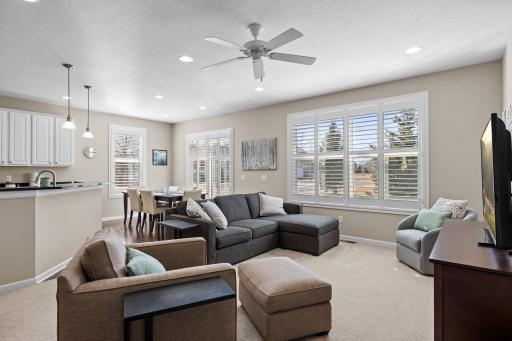 Beautiful upgrades throughout this home offer a perfect blend of luxury and comfort. Plantation shutters, plush carpet, wood floors, and thoughtful design elements create a harmonious blend of style and functionality.