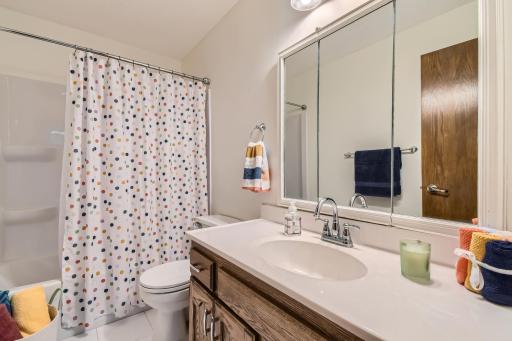 Nice main bath with large vanity and linen closet in the hall.