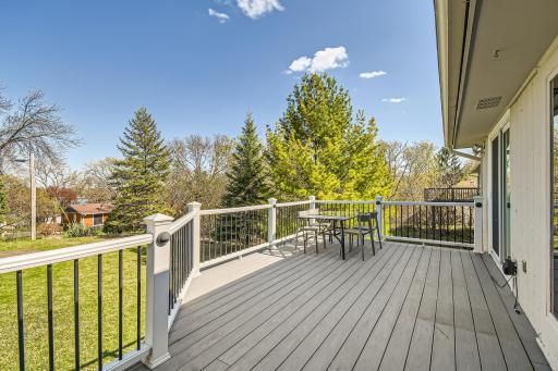 Large low-maintenance deck overlooks the backyard. You can see a bit of Fish Lake through the trees! :)