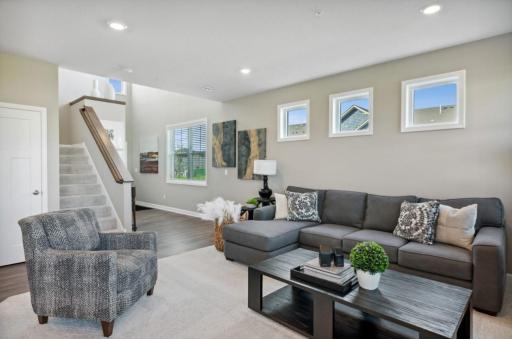 (Photo of decorated model, actual home's finishes will vary) As you enter the home, you will love the large family room offering you 3 picture windows & plenty of space to accommodate family and friends.