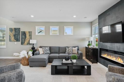 (Photo of decorated model, actual home's finishes will vary) Cozy and contemporary describe the family room.