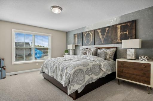 (Photo of decorated model, actual home's finishes will vary) Enjoy plenty of space in the owner's suite!