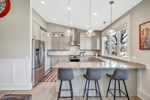 Custom Kitchen is jaw dropping! Granite Countertops, upgraded stainless steel appliances with gas range and vented hood, custom cabinetry with upper glass cabinets with accent lighting, and masterfully designed under cabinet power strips.