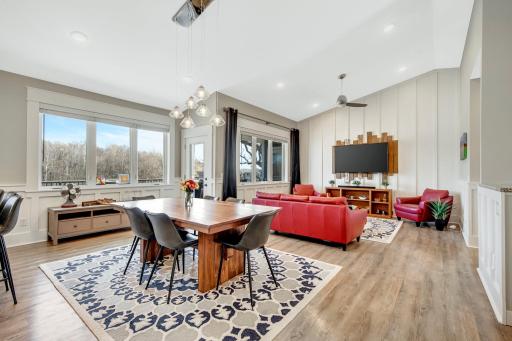 Check out the amazing main level dining and living room spaces. Upon entering the home you will be simply amazed by the views from each window and how natural light completely floods the entire main level.
