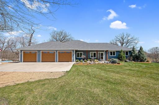 Incredible curb appeal is just the start, this home has an incredibly thoughtful design and style that you must see to fully appreciate. The oversized 3 stall garage is fully finished and heated. The 3rd stall has been divided for a workshop.