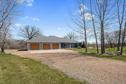 Welcome to this custom designed rambler beautifully situated on almost 4 acres with stunning views! Constructed with top set trusses this home provides zero step entry at the front door and just 1 step from the garage.