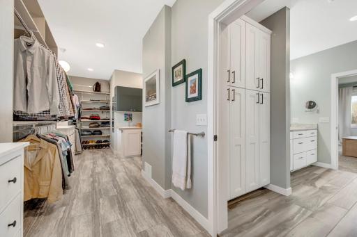 From your primary bath you can directly access this enormous closet that is also home to your laundry area. Built in closet organizing system, and matching dressers that may stay with the home.