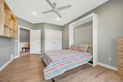 Tall ceilings, LVP Flooring, and large closet are just a few of the additional features of this lower level bedroom.