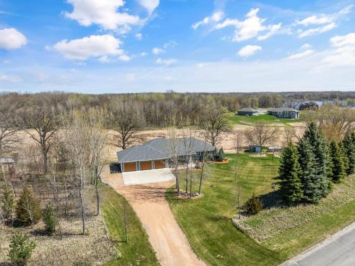 Perfectly situated on 4 acres this home offers breathtaking views of the wetlands and woods, and amazing privacy. Convenient extra parking pad alongside garage is perfect for a trailer, RV, or Boat parking.
