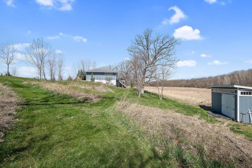 The 4 acre lot extends to the east of the home and includes a great storage shed