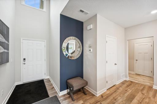 (Photo is of a decorated model, actual homes finishes will vary) You are greeted w/a 2 story open foyer showcasing a large 2nd story window & a nice size mudroom located on the other side of the foyer leading to the 2 stall garage.